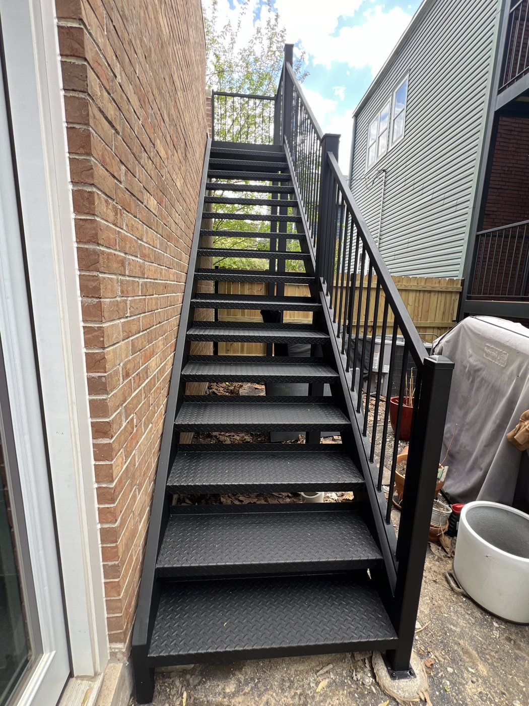 Steel staircase with diamond plate treads